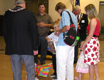 Special Child Ben receiving gifts.